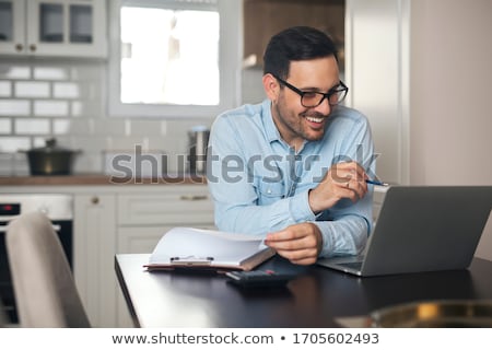Stockfoto: Business Man Working At Office With Laptop Calculator And Docum