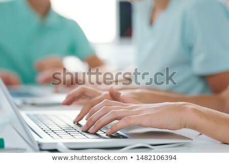 Hands Of Young Female Or Schoolgirl Over Keypad Of Laptop At Workplace Foto stock © Pressmaster