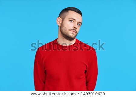 Stock fotó: Shy Confused Man Portrait On Blue Background