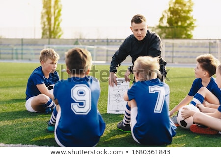 Young Coach Teaching Kids On Football Field Football Coaching Stockfoto © matimix