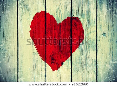 Foto d'archivio: Love Symbol On Old Wooden Wall