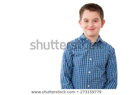 Stockfoto: 10 Year Old Boy With Mischievous Smile On White