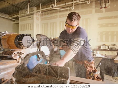Сток-фото: Carpenter Handyman Using Electric Handy Saw