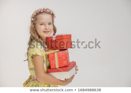 Stockfoto: Beautiful Blonde Woman In Elegant Dress And Heels With Stack Of Presents