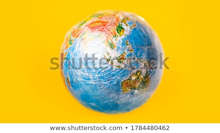 Foto stock: World Globe Wrapped In A Dirty Plastic