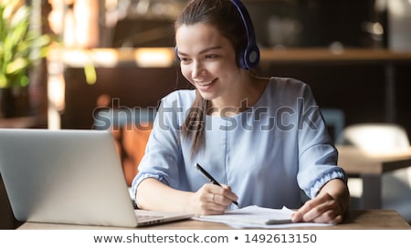 Stock fotó: Young Female Student Preparing For Exams At Home