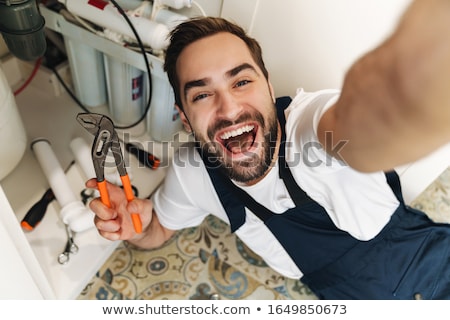 Stock fotó: Optimistic Young Man Plumber Work In Uniform