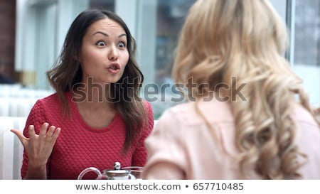 Foto stock: Portrait Of Two Young Women At Restaurant