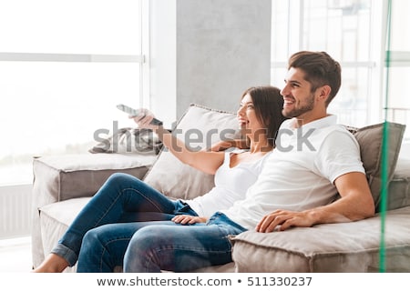 Stock fotó: Happy Couple Watching Favorite Show