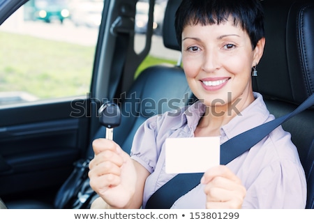 Сток-фото: Senior Smiling Woman Holding Car Key And Empty White Card