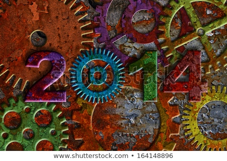 Foto stock: 2014 Rusty Gear On Grunge Texture Background