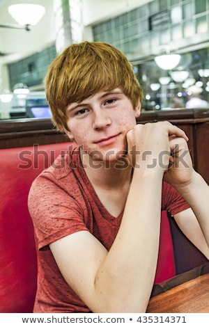 Stock photo: Smiling Boy In A Diners At Night