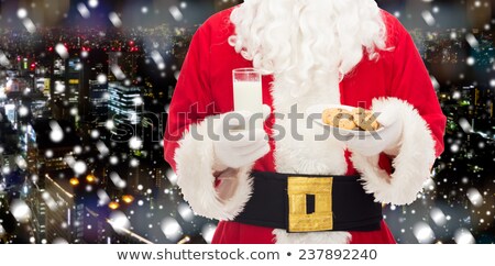 Foto stock: The Man In Costume Of Santa Claus Over Night City Background