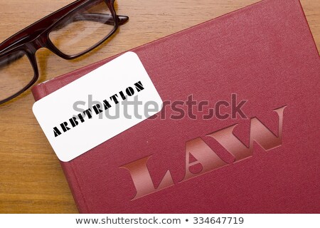 [[stock_photo]]: Book Arbitration Acts With Business Card