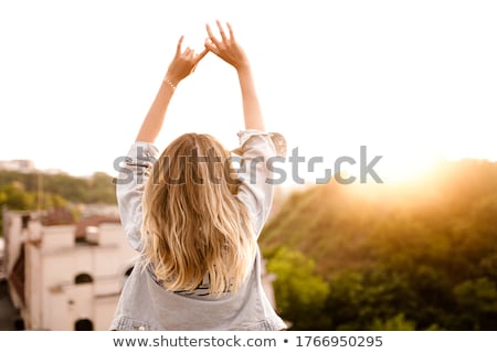 Foto d'archivio: Blond Woman Posing On The Roof