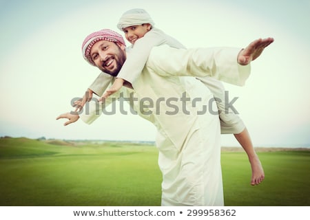 Zdjęcia stock: Arabic Muslim Father And Son Standing Together