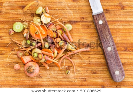 ストックフォト: Scraps Leftover From Cutting Carrots Beside Knife