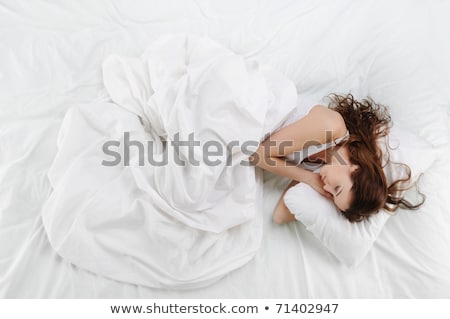 Сток-фото: Happy Pretty Young Woman Lying On Bed At Home