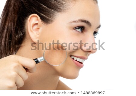 Foto stock: Woman In Beauty Concept With Magnifying Glass Aging Wrinkles