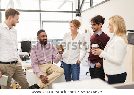 Stockfoto: Creative Team Drinking Coffee At Office