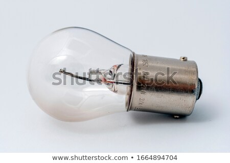 [[stock_photo]]: Headlight Of The Main Light Of The White Car Close Up