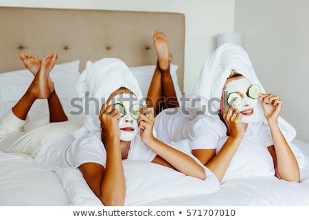 Foto stock: Mother And Daughter Caring For Skin