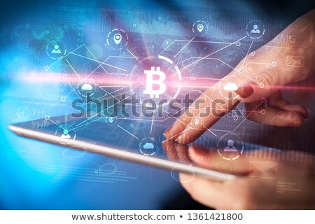 Stockfoto: Hand Using Tablet With Bitcoin Link Network And Online Concept