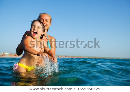 ストックフォト: Happy Young Family With Little Kids In The Pool