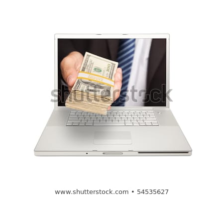 Foto stock: Hand With Money Out Of Laptop Display