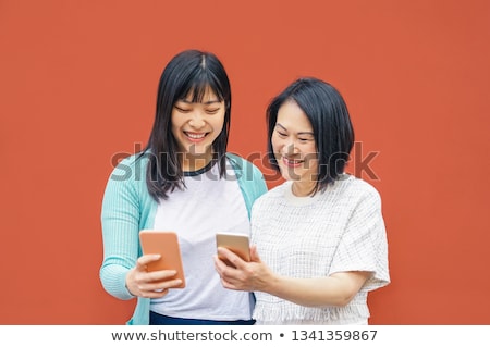 Foto stock: Senior Woman On Market Using Mobile Phone