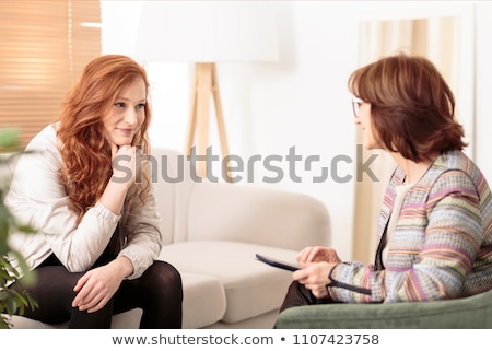 Stock photo: Smiling Woman Talking With A Coach To Find The Motivation To Achieve The Goals Of Financial Success