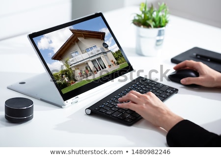 Stock photo: Woman Searching For Real Estate Online