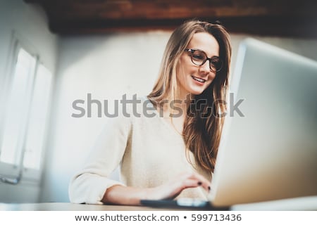 Сток-фото: Beautiful Girl With Glasses Working On Computer