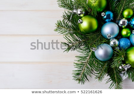 Holiday Ornaments Hanging From Blue Spruce Tree Branch [[stock_photo]] © TasiPas