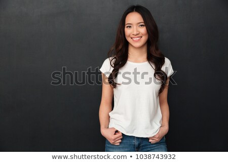 Foto stock: Portrait Of Happy Chinese Woman With Long Dark Hair Smiling At C