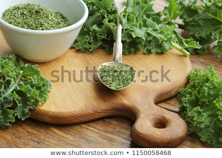 Stockfoto: Chopped Dry Kale Leaves On Rustic Background