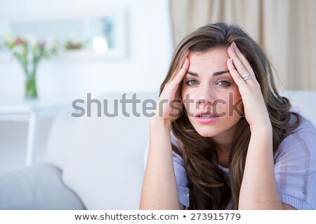 Stock photo: Unhappy Woman Suffering From Head Ache At Home