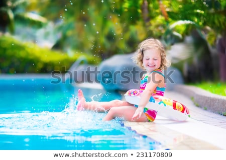 Foto stock: Happy Beautiful Girl Having Fun At The Pool