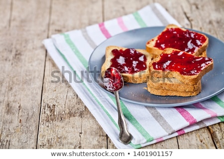 Stockfoto: Fresh Toasted Cereal Bread Slices With Homemade Cherry Jam In Ja