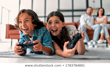 Foto stock: Happy Mother And Daughter Playing Video Game Together