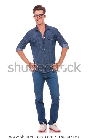 Stock fotó: Casual Man With Glasses Standing With Hands On Hips