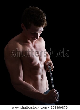 Foto stock: Strong Athletic Man On Dark Grunge Background