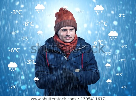 Foto stock: Boy Freezing In Warm Clothing With Weather Condition Concept