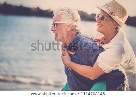 Foto stock: Couple Having Fun On Beach Holiday