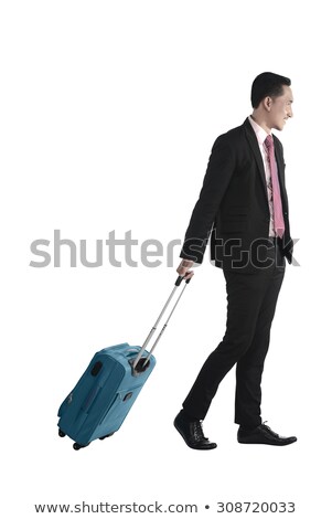 Сток-фото: Laughing Young Businessman Is Walking With Suitcase