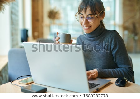 Foto stock: Female Editor Working On Laptop