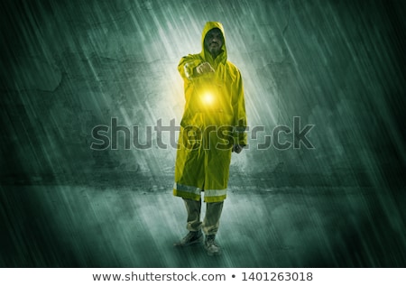 Foto d'archivio: Wayfarer With Lantern In Front Of Crumbly Wall