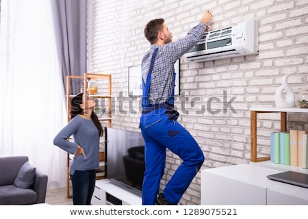 Сток-фото: Woman Technician Servicing At Work On Electric Room