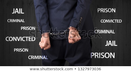 Stock photo: Close Convicted With Labels And Handcuffs