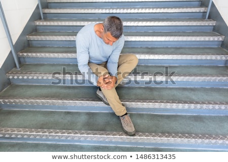 Zdjęcia stock: Mature Man Sitting On Staircase